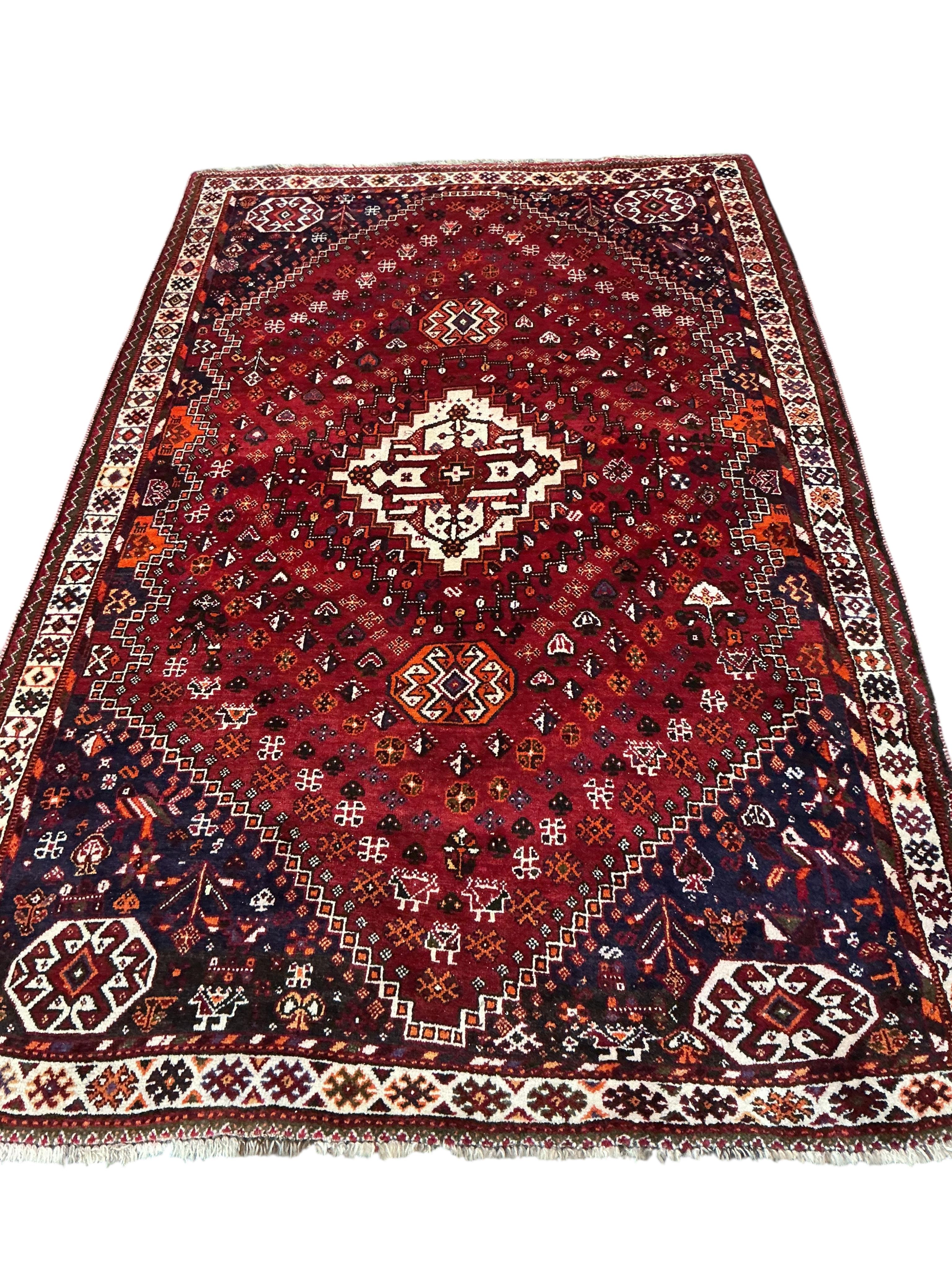 A Hamadan red ground rug 255 x 162cm